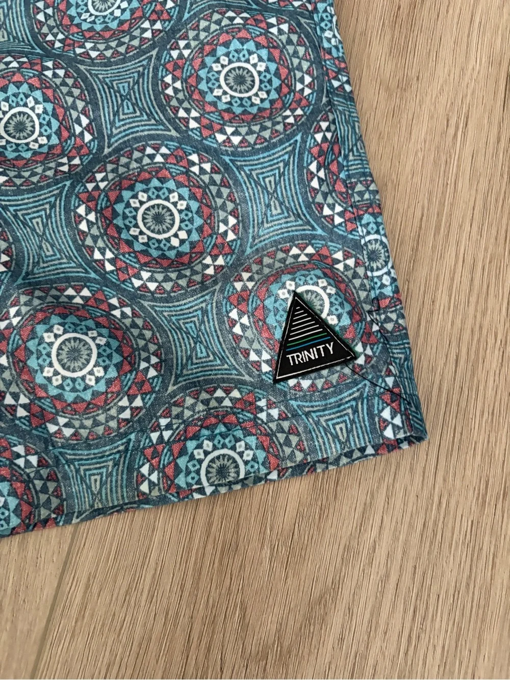 Trinity Teal & Red Geometric Medallion Swim Trunks